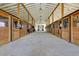 Spacious horse barn with multiple stalls and ample lighting for a comfortable environment at 3949 Bulow Landing Rd, Ravenel, SC 29470