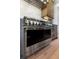 A Monogram range offers a pro-style appliance and stainless steel finish at 3949 Bulow Landing Rd, Ravenel, SC 29470