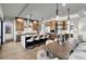 Modern kitchen features a large island with bar seating, stainless steel appliances, and recessed lighting at 3949 Bulow Landing Rd, Ravenel, SC 29470