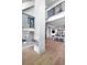 Open concept living area with iron railing, hardwood floors, and great natural light at 3949 Bulow Landing Rd, Ravenel, SC 29470