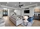 Bright living room features a fireplace, recessed lighting, and an open staircase to the upper level at 3949 Bulow Landing Rd, Ravenel, SC 29470