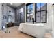 A neutral spa bathroom is finished with glass shower and soaking tub at 3949 Bulow Landing Rd, Ravenel, SC 29470