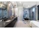 A spa bathroom is finished with double vanity and glass shower at 3949 Bulow Landing Rd, Ravenel, SC 29470