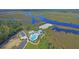 Aerial shot of a neighborhood pool with river access and community parking for residents at 3949 Bulow Landing Rd, Ravenel, SC 29470