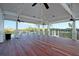 Relaxing porch with a beautiful view, ceiling fans, and a wooden floor, providing a comfortable outdoor retreat at 3949 Bulow Landing Rd, Ravenel, SC 29470