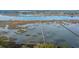 Scenic aerial shot showcases multiple long piers stretching into the expansive waterfront property at 3970 Betsy Kerrison Pkwy, Johns Island, SC 29455