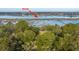 An aerial view of a waterfront home with a private dock extending into the marsh at 3970 Betsy Kerrison Pkwy, Johns Island, SC 29455