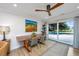 Dining area with outdoor views, natural wood table, stylish chairs, and modern lighting at 3970 Betsy Kerrison Pkwy, Johns Island, SC 29455