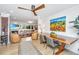 Bright open-concept room with wood floors, elegant furniture, and a captivating painting at 3970 Betsy Kerrison Pkwy, Johns Island, SC 29455
