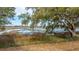 Picturesque marsh view featuring a long wooden walkway leading through the water with trees in the foreground at 3970 Betsy Kerrison Pkwy, Johns Island, SC 29455