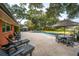 Beautiful backyard pool area featuring a pool, patio with lounge chairs and a dining table with umbrella for shade at 3970 Betsy Kerrison Pkwy, Johns Island, SC 29455
