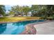 Beautiful pool area surrounded by lush greenery and flowering plants, offers a serene setting for relaxation and recreation at 3970 Betsy Kerrison Pkwy, Johns Island, SC 29455
