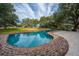 Enjoy a private pool, perfect for relaxation, complemented by a dining set overlooking serene green surroundings at 3970 Betsy Kerrison Pkwy, Johns Island, SC 29455