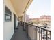 Long balcony overlooking a city with outdoor access and railing at 40 Bee Street # 314, Charleston, SC 29403