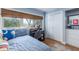 Comfortable bedroom featuring a bed, desk, and a view of outside, perfect for relaxation and productivity at 40 Bee Street # 314, Charleston, SC 29403