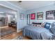 Well-appointed bedroom with comfortable bed, living area view, and decor for relaxation and personal style at 40 Bee Street # 314, Charleston, SC 29403