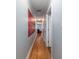 Hallway leading to living room with hardwood floors and neutral paint, creating a warm and inviting atmosphere at 40 Bee Street # 314, Charleston, SC 29403