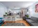 Open living space featuring a kitchen with a breakfast bar and a seating area for comfort and convenience at 40 Bee Street # 314, Charleston, SC 29403