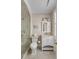 Classic bathroom featuring tiled shower, toilet, vanity, and shuttered window at 40 New St, Charleston, SC 29401