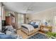 Cozy bedroom with stylish furnishings, blue accents, and window providing natural light at 40 New St, Charleston, SC 29401