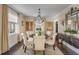 Charming dining room featuring a chandelier, large windows, and stylish furnishings at 40 New St, Charleston, SC 29401