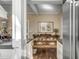 Open concept view into the dining room and kitchen showcasing hardwood floors and stainless appliances at 40 New St, Charleston, SC 29401