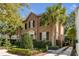 Beautiful brick home with lush landscaping and palm trees in a desirable location at 40 New St, Charleston, SC 29401