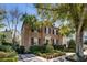 Beautiful brick home with black shutters, mature trees, and manicured landscaping at 40 New St, Charleston, SC 29401