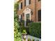 Charming brick home entrance with manicured landscaping, and an inviting doorway at 40 New St, Charleston, SC 29401