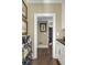 Hallway featuring a wine rack, hardwood floors, and doorway views into adjacent rooms at 40 New St, Charleston, SC 29401