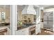 Stylish kitchen island features a cooktop and stainless steel oven, open to dining and living spaces at 40 New St, Charleston, SC 29401