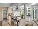 Sunlit kitchen with a modern island, stainless steel appliances, and seamless connection to the living area at 40 New St, Charleston, SC 29401