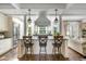 Bright kitchen with stylish island, modern appliances, and pendant lighting overlooking the living area at 40 New St, Charleston, SC 29401