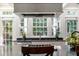 Beautiful kitchen featuring a cooktop, sleek countertops, stainless steel appliances, and bright windows at 40 New St, Charleston, SC 29401