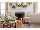 Close up of a Living Room with a fireplace, classic furnishings, and a decorative mirror at 40 New St, Charleston, SC 29401