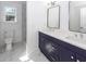 A luxurious bathroom featuring a double vanity with a toilet and a shower at 405 Simmons Ave, Summerville, SC 29483