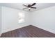 Bedroom featuring vinyl plank flooring, ceiling fan, a window and view to adjacent houses at 405 Simmons Ave, Summerville, SC 29483
