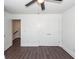Bedroom with modern ceiling fan and closet featuring double doors; a door leads to an adjacent hallway at 405 Simmons Ave, Summerville, SC 29483