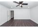 Another view of the large bedroom featuring dark hardwood floors and a ceiling fan at 405 Simmons Ave, Summerville, SC 29483