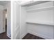 White closet with wood-look flooring, open door shows view to adjacent hallway and bedroom at 405 Simmons Ave, Summerville, SC 29483