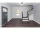 Entryway with hardwood floors, staircase, decorative door and trim, and neutral walls at 405 Simmons Ave, Summerville, SC 29483