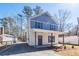 Charming two-story home with a welcoming front porch and manicured landscaping at 405 Simmons Ave, Summerville, SC 29483