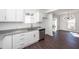 Kitchen featuring stainless steel dishwasher and a view into the bright dining area at 405 Simmons Ave, Summerville, SC 29483