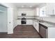 Bright kitchen featuring stainless steel appliances, granite counters, and white cabinets at 405 Simmons Ave, Summerville, SC 29483