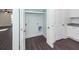 Neat laundry area with hookups and a storage shelf, conveniently located off the kitchen at 405 Simmons Ave, Summerville, SC 29483