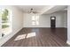 Bright and airy living room featuring dark hardwood floors, neutral walls and lots of natural light at 405 Simmons Ave, Summerville, SC 29483