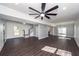 Open floor plan living room featuring hardwood floors and modern ceiling fan and lighting at 405 Simmons Ave, Summerville, SC 29483