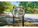 Azalea Park sign amid lush greenery, inviting visitors to enjoy the natural beauty and tranquility at 4111 Rising Tide Dr, Summerville, SC 29485