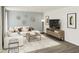 Stylish living room with comfortable seating and a decorative wall design at 4179 Rising Tide Dr, Summerville, SC 29485