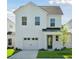 Charming two-story home featuring a one car garage, craftsman details, and a neatly manicured lawn at 420 Queen View Ln, Charleston, SC 29414